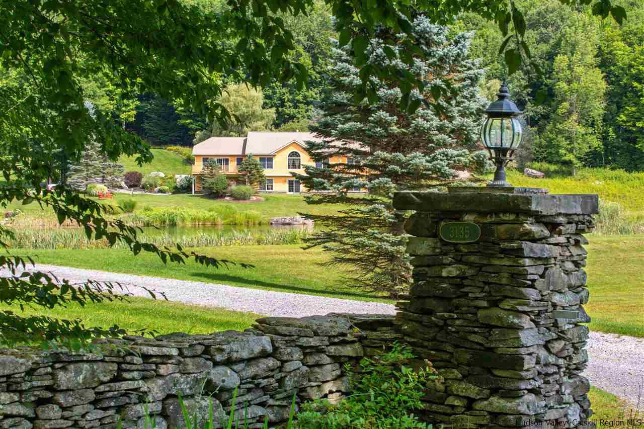 3135 Canada Hollow Road Andes, NY 13731 - Photo 33 of 33 a view of a garden with a bench