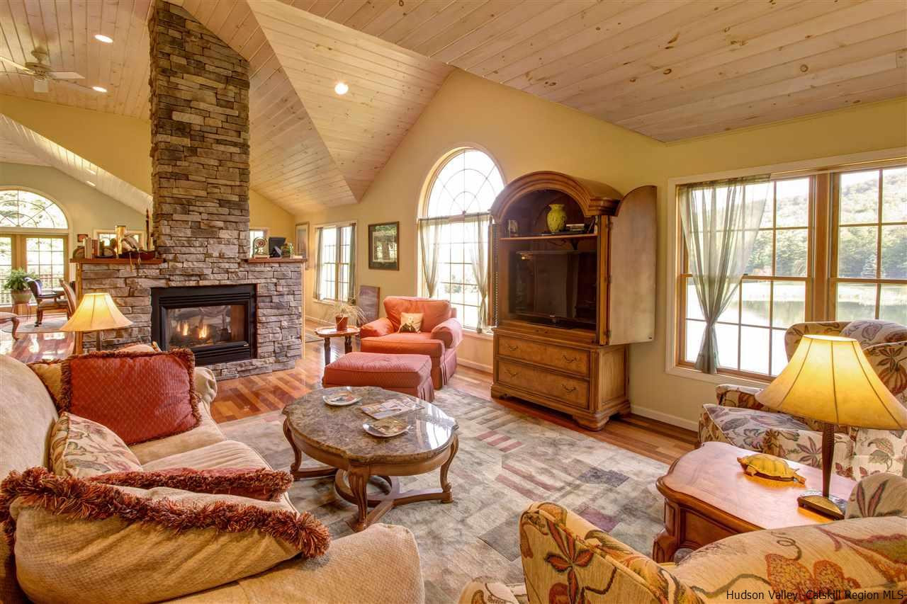 3135 Canada Hollow Road Andes, NY 13731 - Photo 6 of 33 a living room with furniture and a fireplace