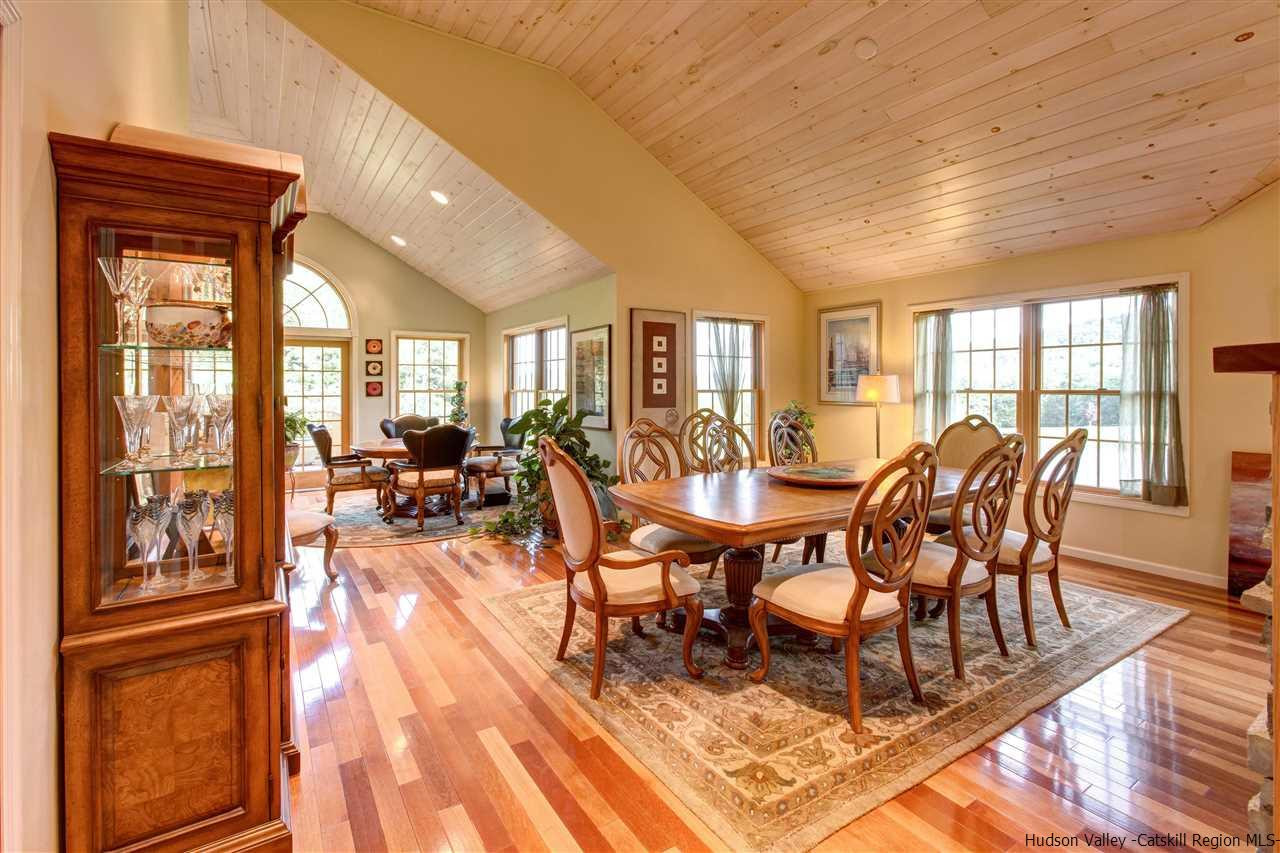3135 Canada Hollow Road Andes, NY 13731 - Photo 9 of 33 a view of a dining room with furniture a chandelier and wooden floor