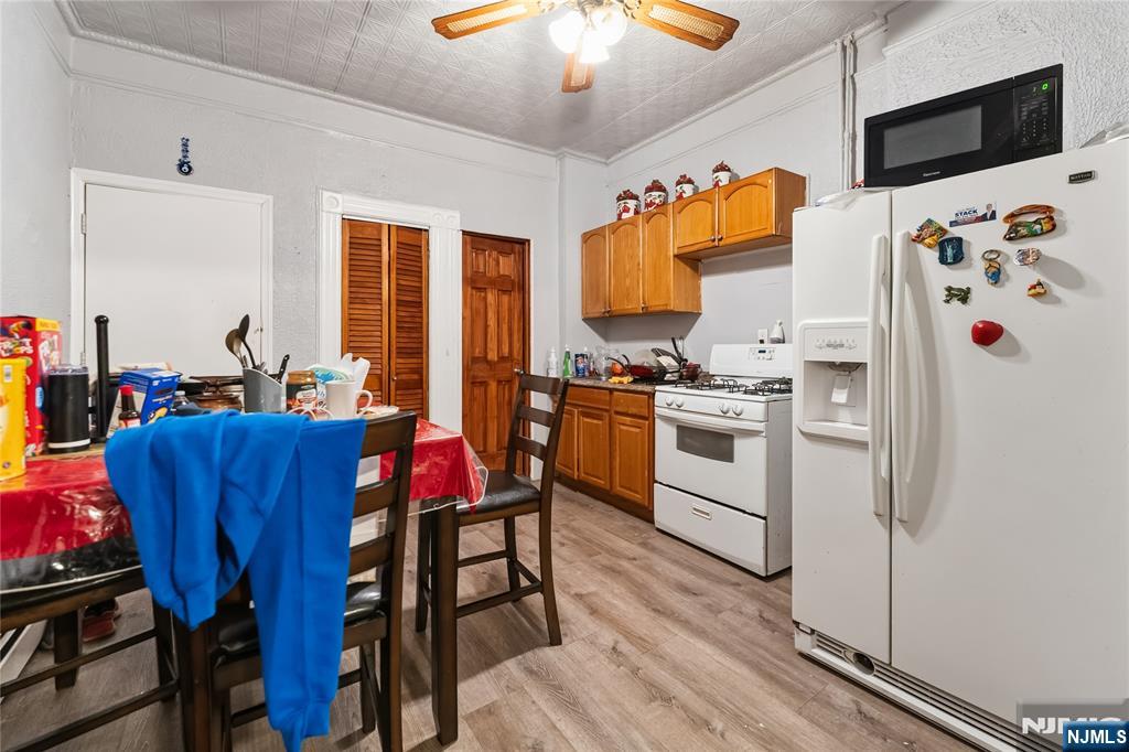 123 47th Street Union City, NJ 07087 - Photo 12 of 27 a kitchen with stainless steel appliances a stove a sink dishwasher and a refrigerator