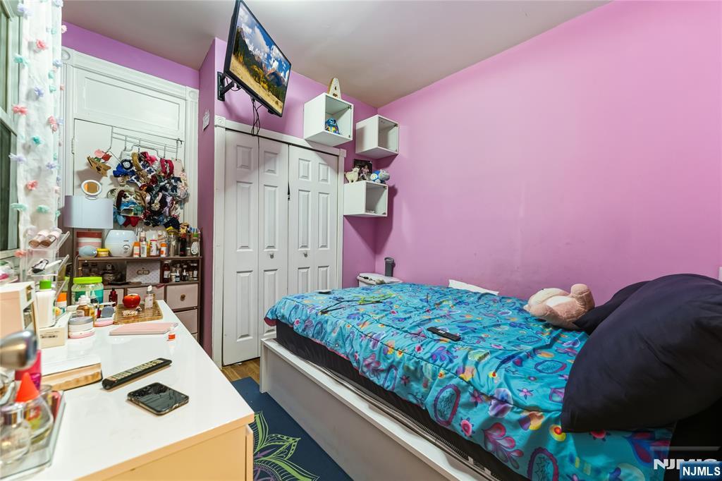 123 47th Street Union City, NJ 07087 - Photo 15 of 27 a bedroom with bed and a bed