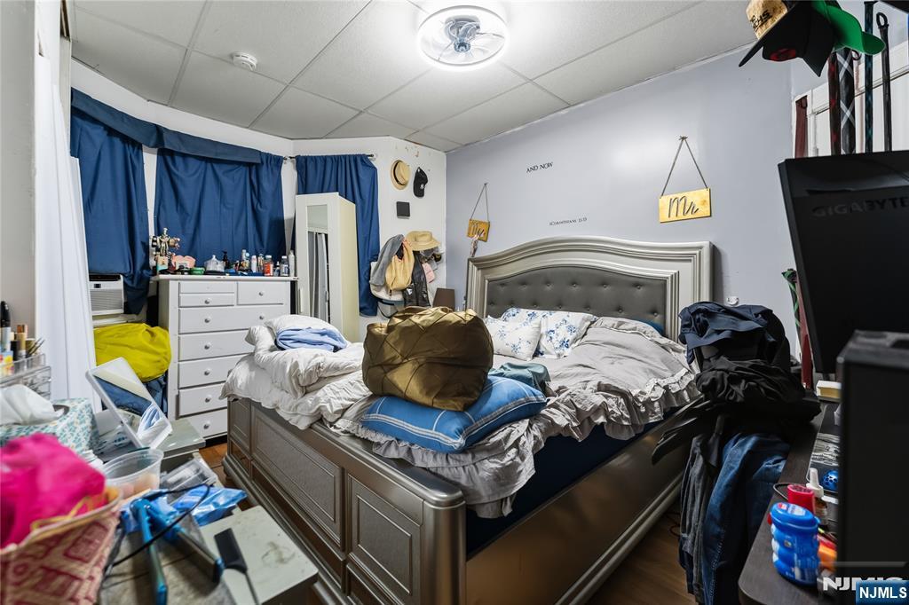 123 47th Street Union City, NJ 07087 - Photo 16 of 27 a bed room with a bed and a window