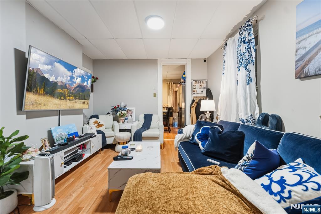 123 47th Street Union City, NJ 07087 - Photo 5 of 27 a living room with furniture and wooden floor