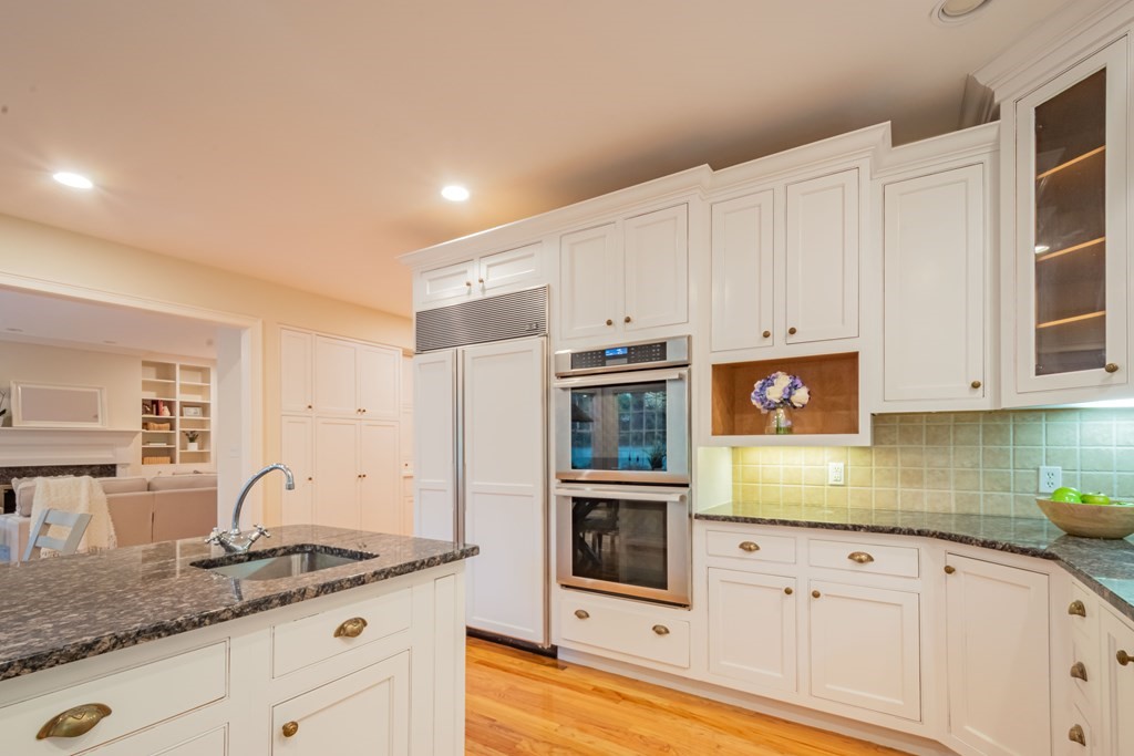 40 Winthrop Road Lexington, MA 02421 - Photo 13 of 42 a kitchen with granite countertop white cabinets and stainless steel appliances