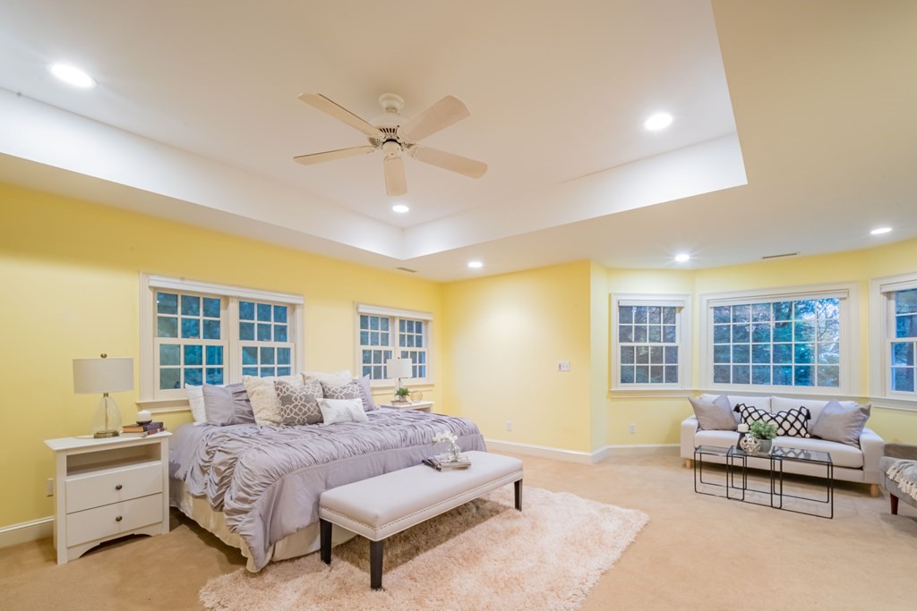 40 Winthrop Road Lexington, MA 02421 - Photo 25 of 42 a spacious bedroom with a bed and a couch