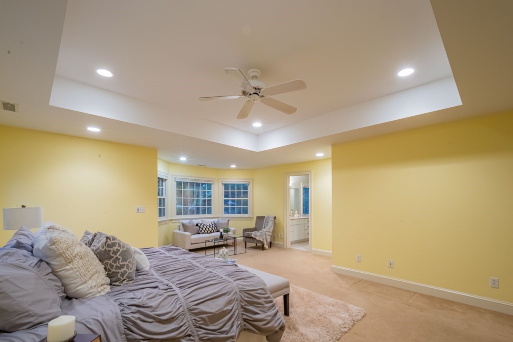 40 Winthrop Road Lexington, MA 02421 - Photo 26 of 42 a spacious bedroom with a bed window and couch