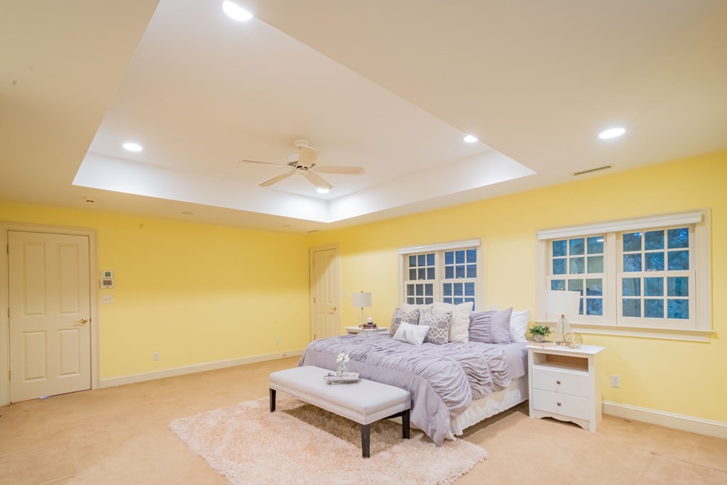 40 Winthrop Road Lexington, MA 02421 - Photo 28 of 42 a spacious bedroom with a bed and a window