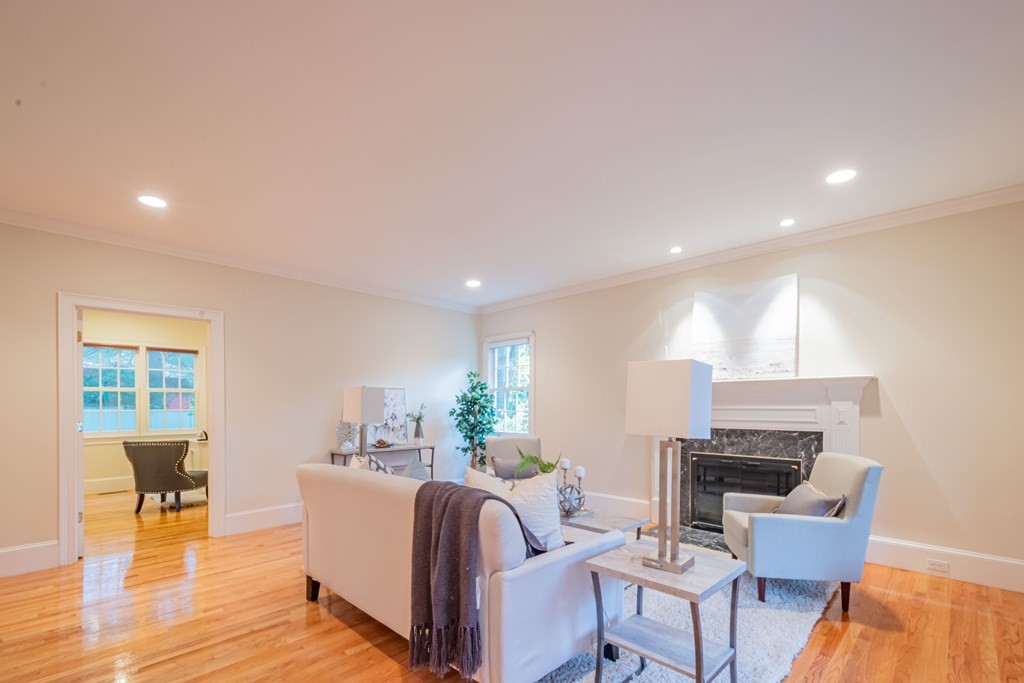 40 Winthrop Road Lexington, MA 02421 - Photo 3 of 42 a living room with furniture a dining table and a potted plant