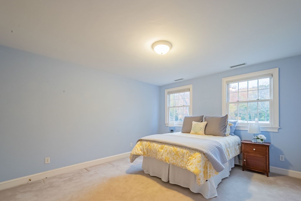 40 Winthrop Road Lexington, MA 02421 - Photo 31 of 42 a bedroom with a bed and window