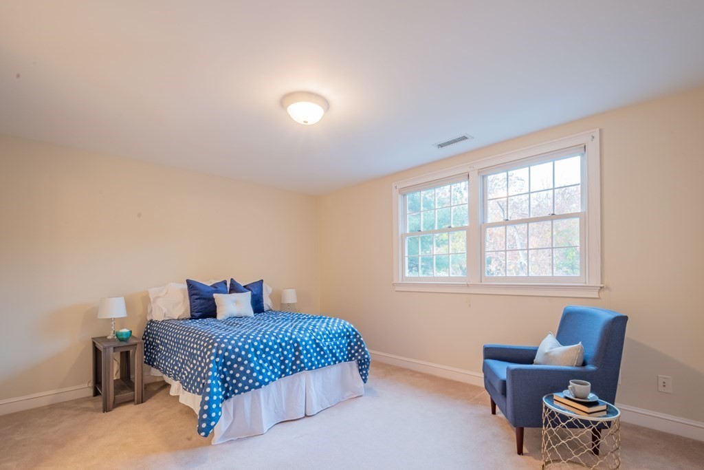40 Winthrop Road Lexington, MA 02421 - Photo 33 of 42 a bedroom with a bed chair and window