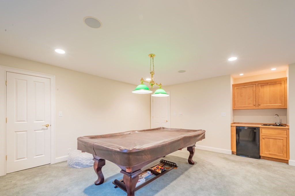 40 Winthrop Road Lexington, MA 02421 - Photo 37 of 42 a living room with a table chairs and entryway