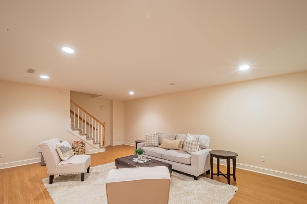 40 Winthrop Road Lexington, MA 02421 - Photo 39 of 42 a living room with furniture and a wooden floor