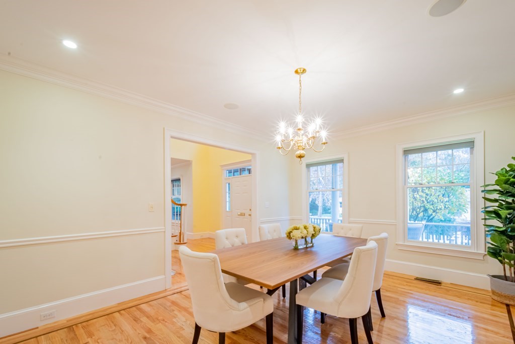 40 Winthrop Road Lexington, MA 02421 - Photo 9 of 42 a view of a dining room with furniture a chandelier and wooden floor
