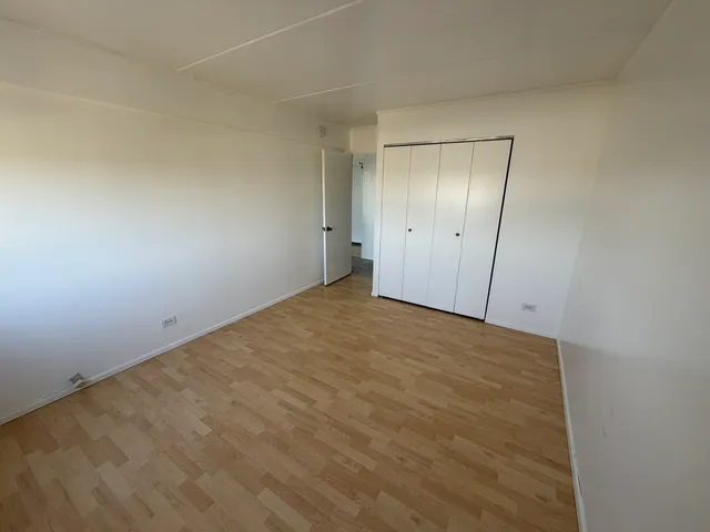 a bathroom with a toilet sink a mirror and vanity