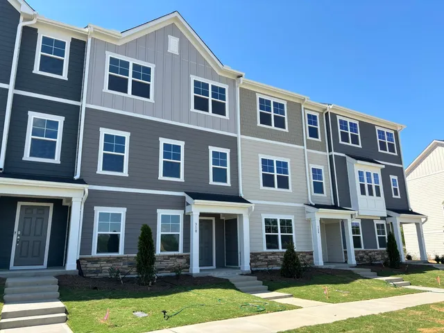a front view of residential building with yard