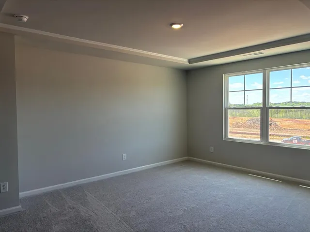 an empty room with a empty space and a window