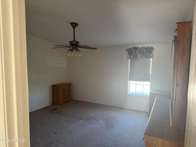 a bathroom with a sink and mirror with toilet