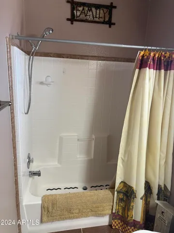 a bathroom with a toilet a sink and a mirror