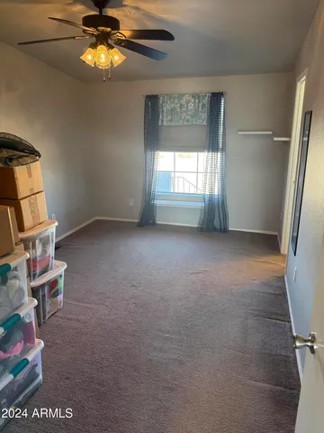 a view of livingroom with furniture and chandelier fan