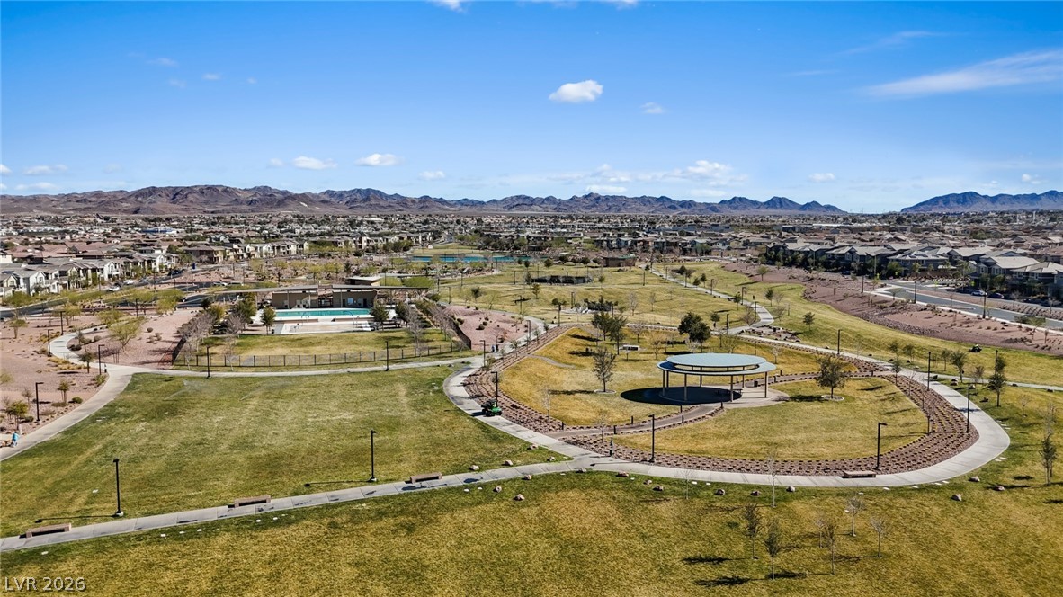 250 Dedication Avenue Henderson, NV 89011 - Photo 50 of 67 Aerial perspective of suburban area with mountains and a recreational park