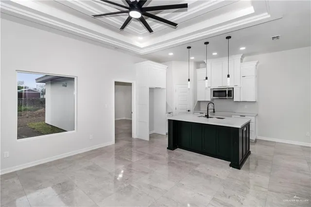 a view of cabinets and a kitchen with a sink