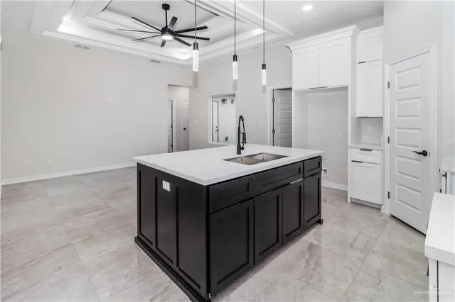 a kitchen with a sink a stove a refrigerator and cabinets