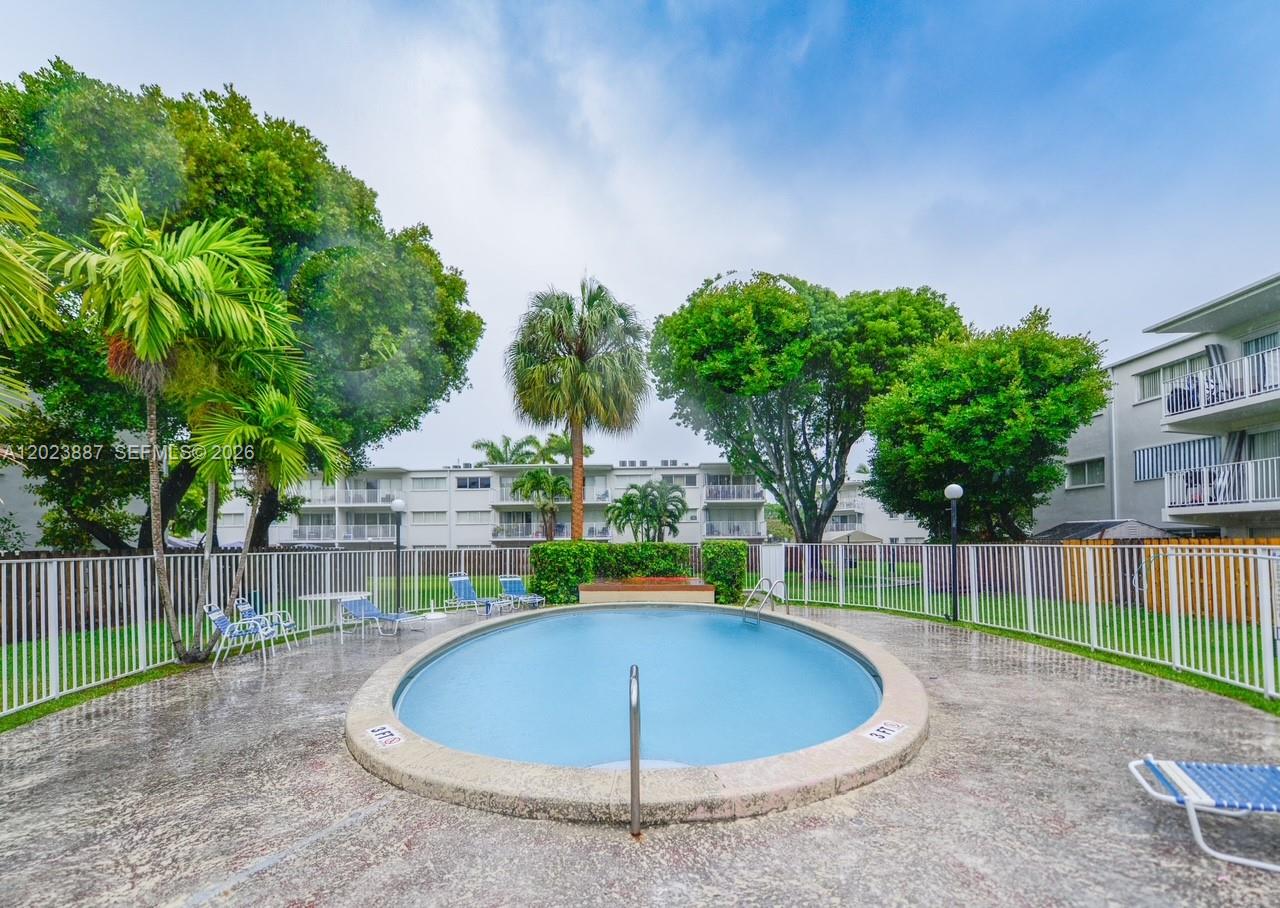 7737 Southwest 88th Street, Unit C312 Miami, FL 33156 - Photo 29 of 32 a view of outdoor space and yard