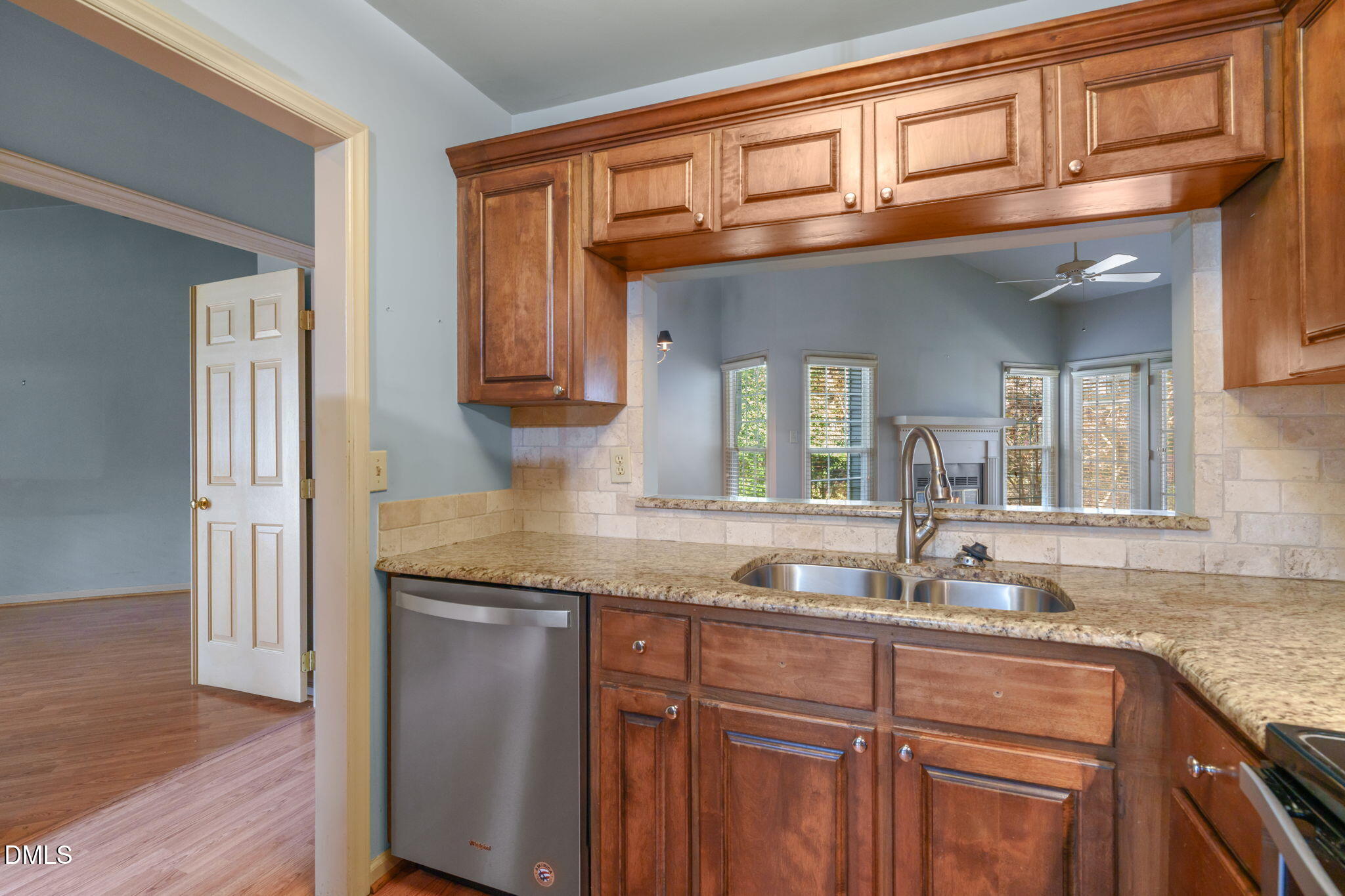 1212 Berley Court Raleigh, NC 27609 - Photo 12 of 38 a bathroom with granite countertop a sink and a wooden cabinets