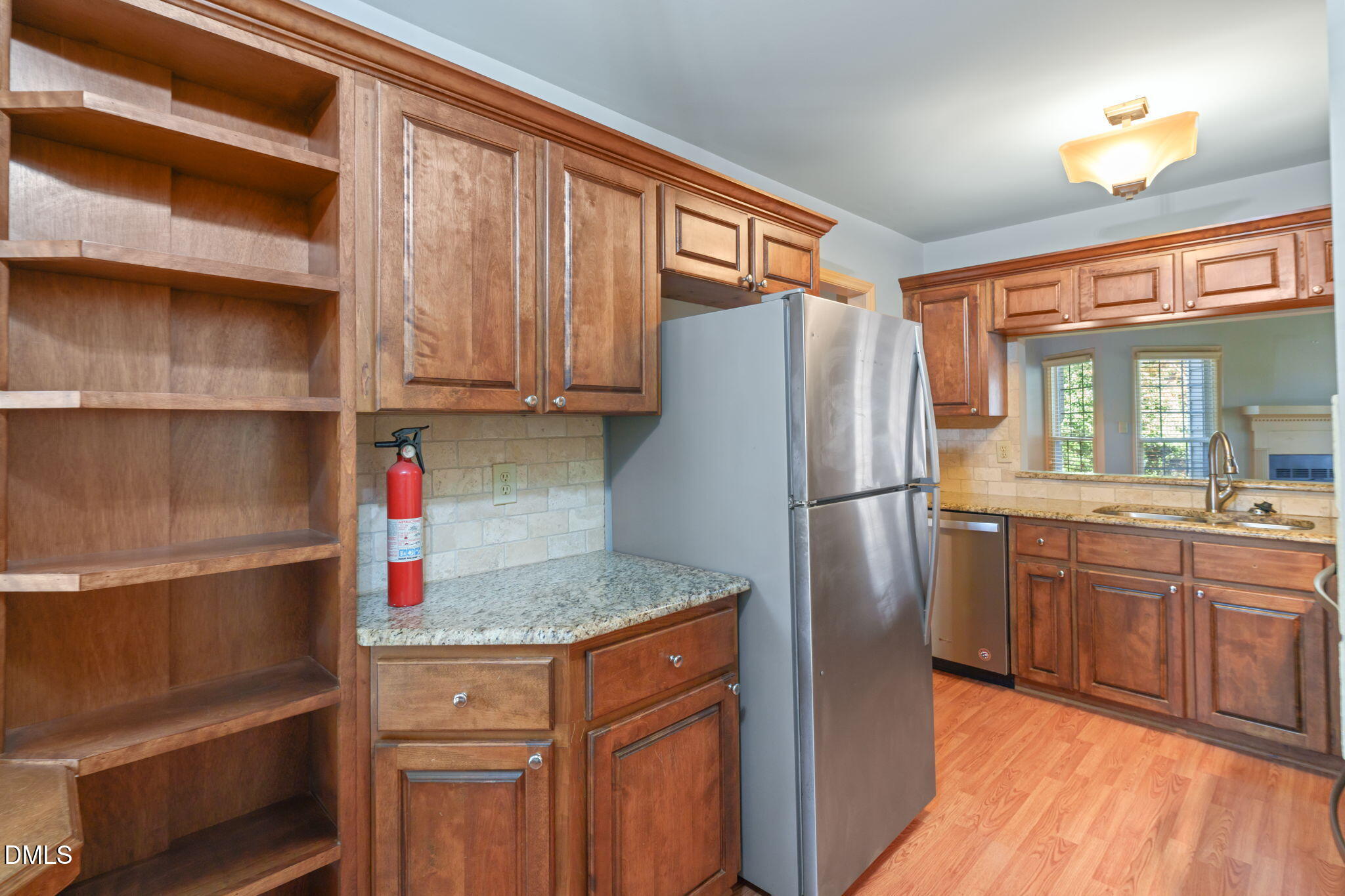 1212 Berley Court Raleigh, NC 27609 - Photo 16 of 38 a kitchen with stainless steel appliances granite countertop a refrigerator and a sink