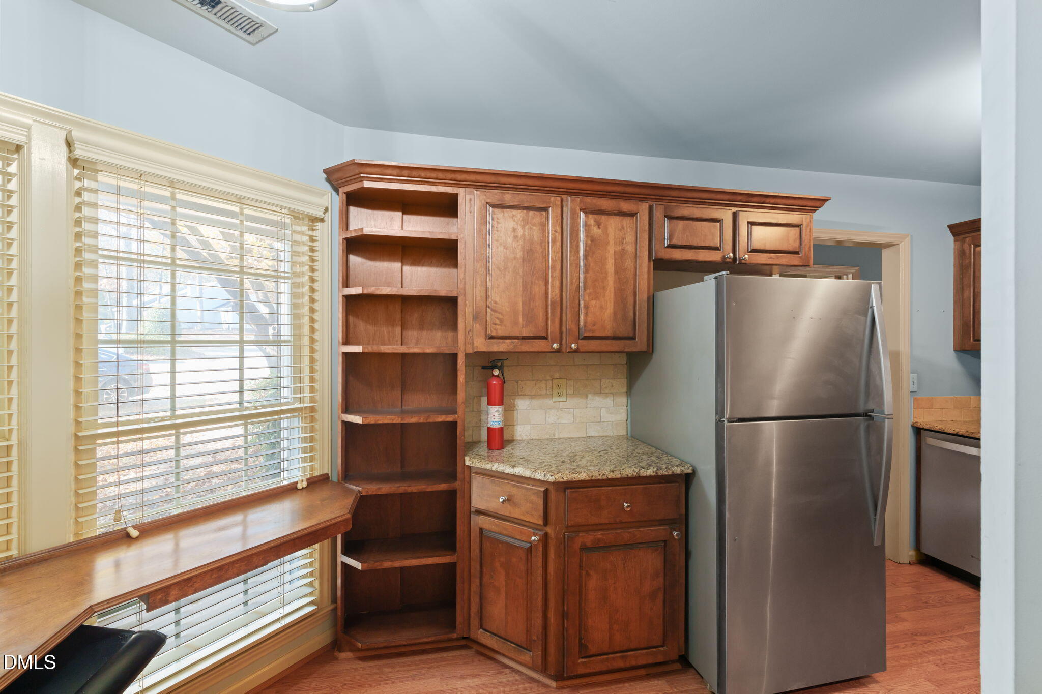 1212 Berley Court Raleigh, NC 27609 - Photo 20 of 38 a kitchen with stainless steel appliances granite countertop a refrigerator and a stove top oven