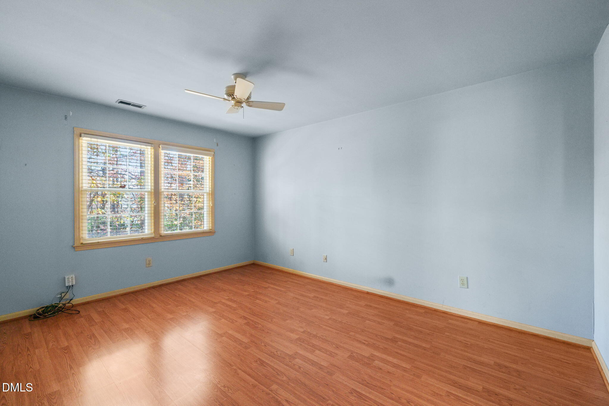 1212 Berley Court Raleigh, NC 27609 - Photo 21 of 38 wooden floor in an empty room with a window