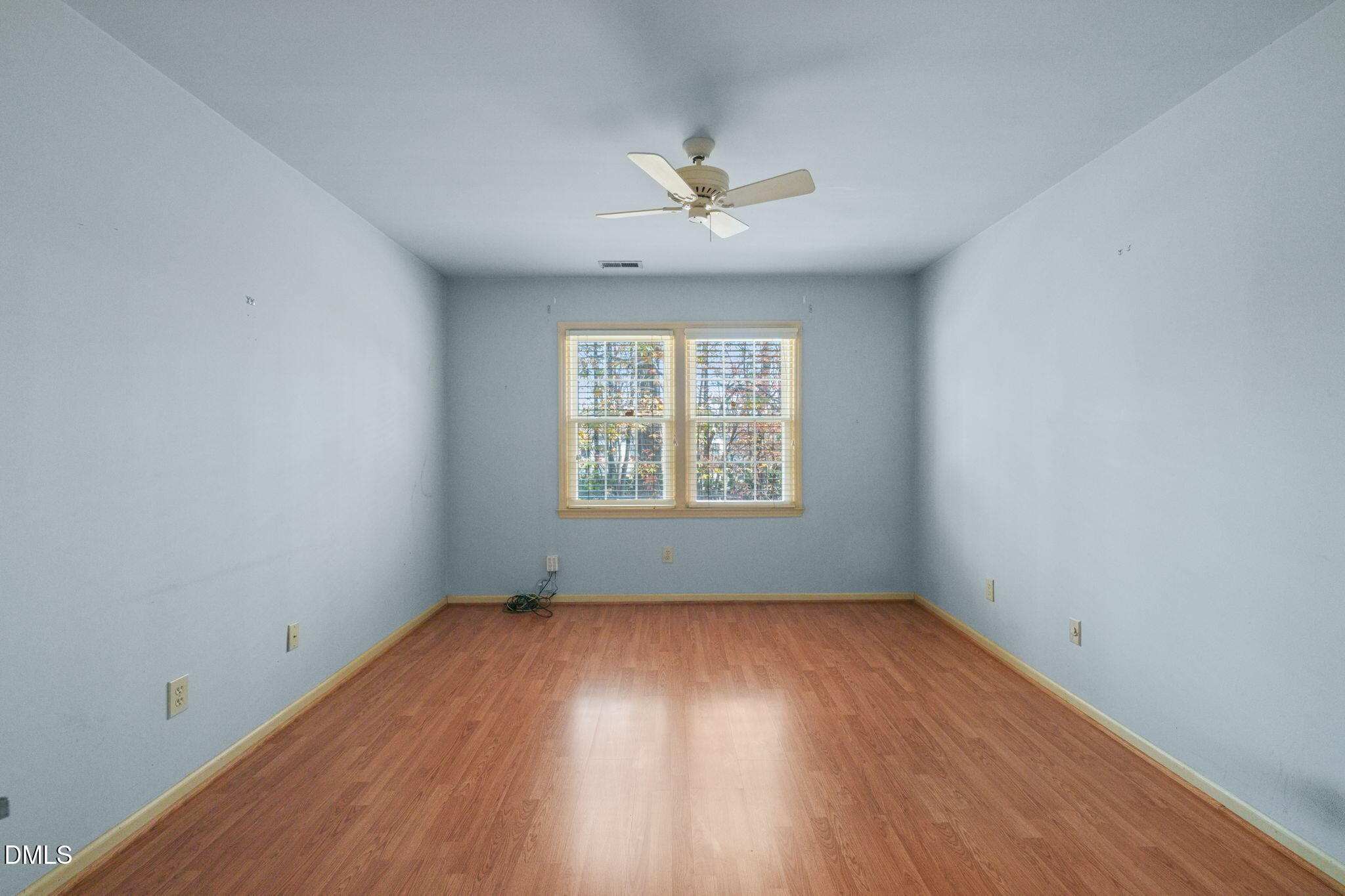 1212 Berley Court Raleigh, NC 27609 - Photo 22 of 38 wooden floor in an empty room with a window