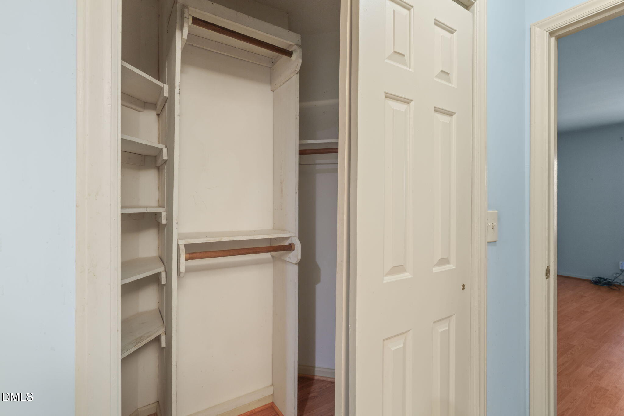1212 Berley Court Raleigh, NC 27609 - Photo 26 of 38 a view of walk in closet with empty racks
