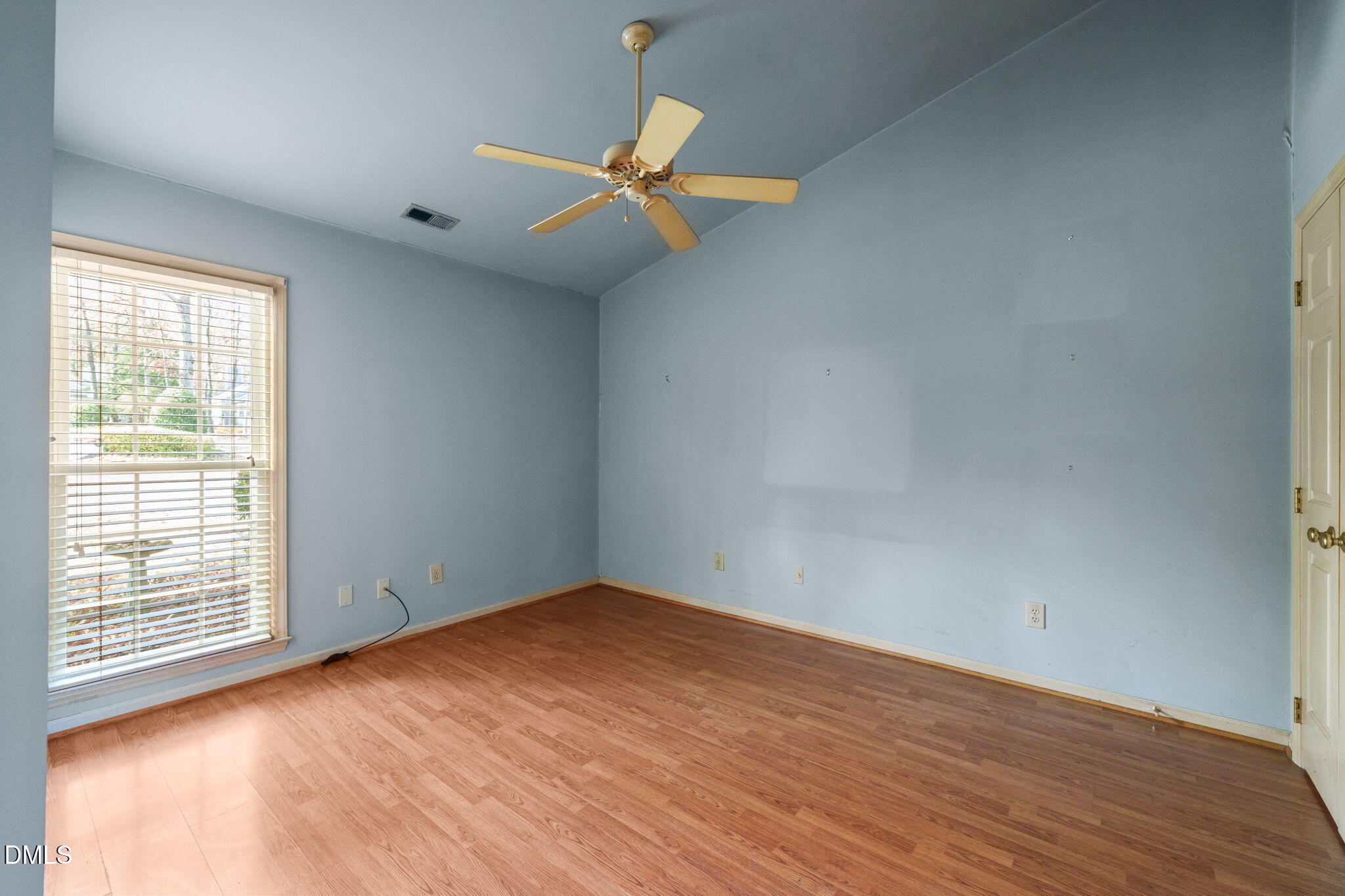 1212 Berley Court Raleigh, NC 27609 - Photo 28 of 38 an empty room with wooden floor fan and windows