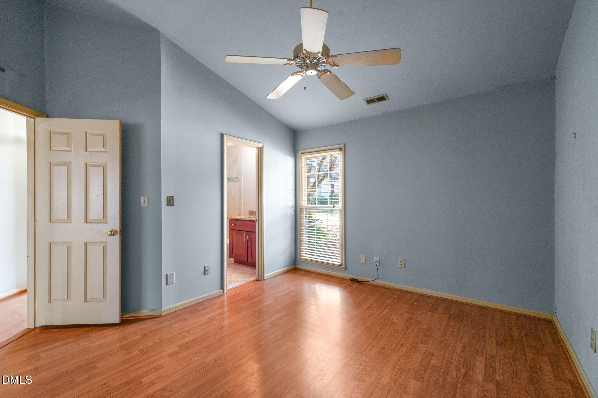 1212 Berley Court Raleigh, NC 27609 - Photo 29 of 38 a view of an empty room with window and wooden floor