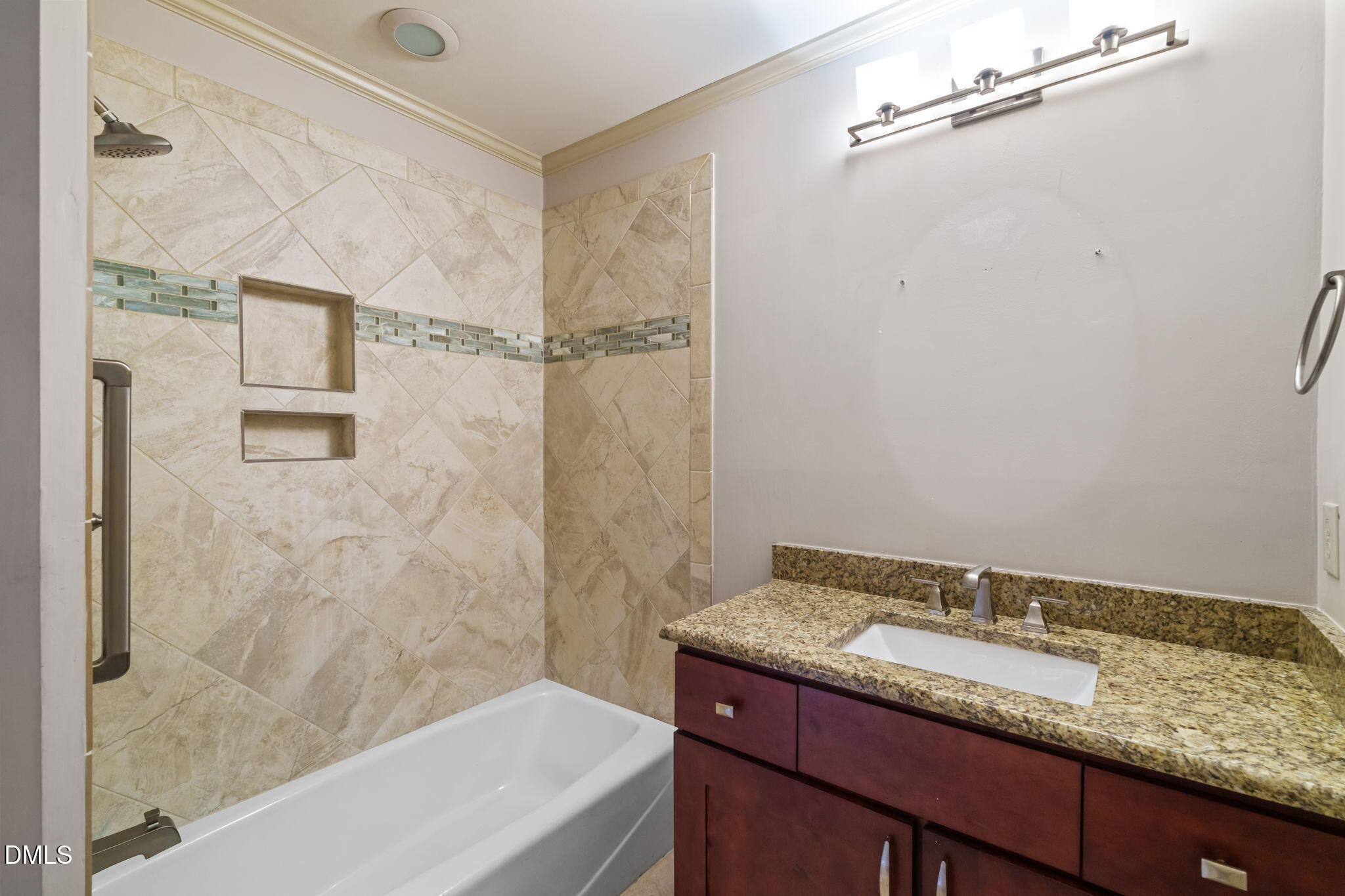 1212 Berley Court Raleigh, NC 27609 - Photo 31 of 38 a bathroom with a granite countertop sink and a mirror