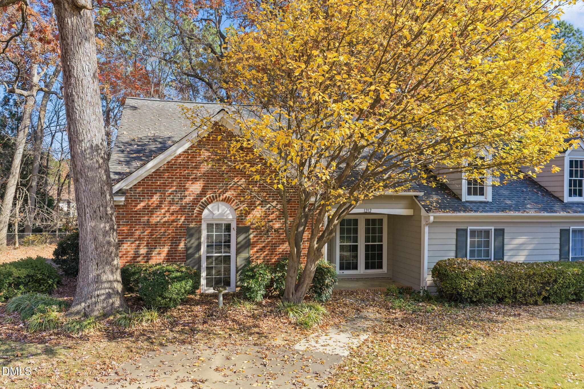 1212 Berley Court Raleigh, NC 27609 - Photo 37 of 38 a front view of a house with a garden
