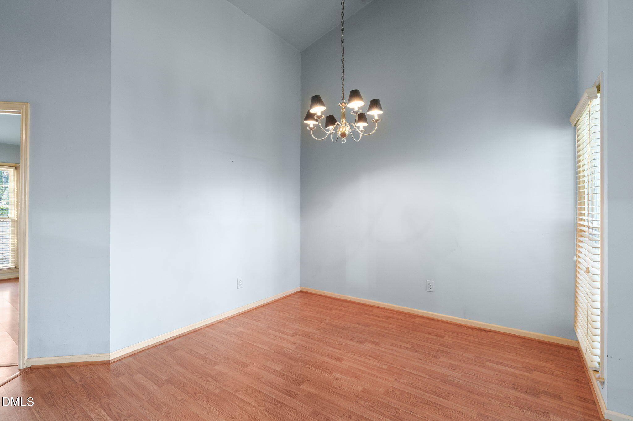 1212 Berley Court Raleigh, NC 27609 - Photo 6 of 38 a view of a room with wooden floor and a window