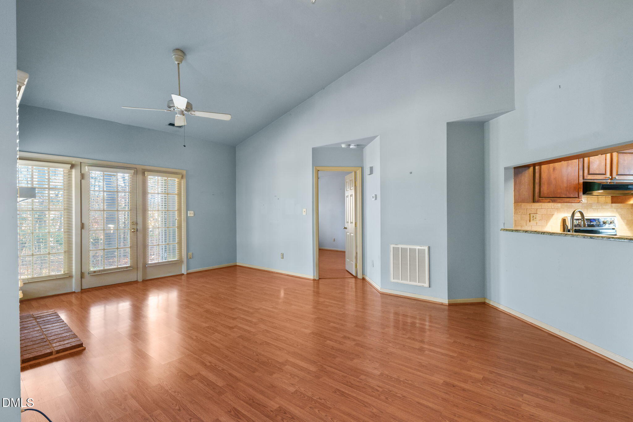 1212 Berley Court Raleigh, NC 27609 - Photo 7 of 38 a view of an empty room with wooden floor and a window