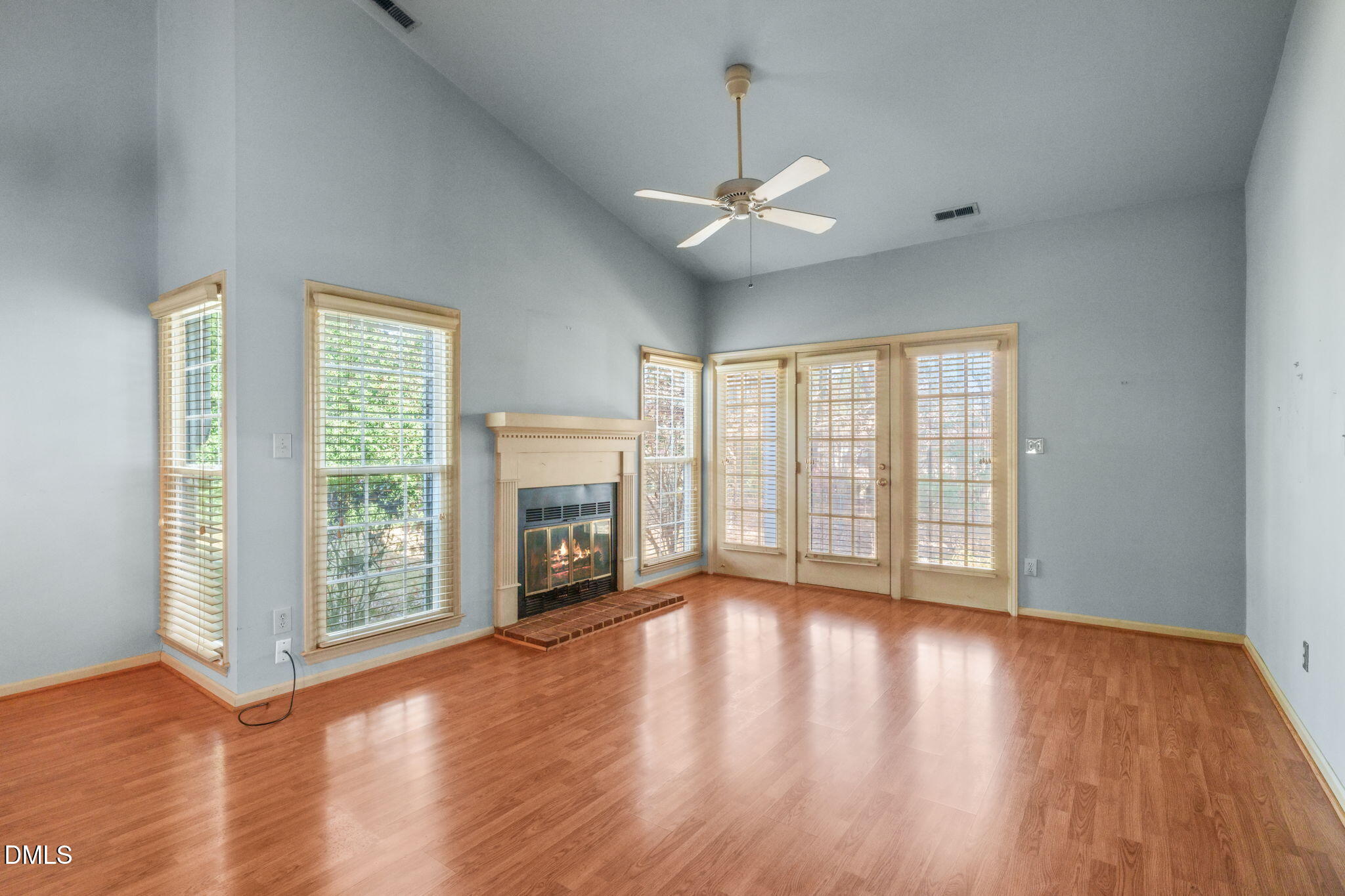 1212 Berley Court Raleigh, NC 27609 - Photo 8 of 38 a view of an empty room with wooden floor and a window