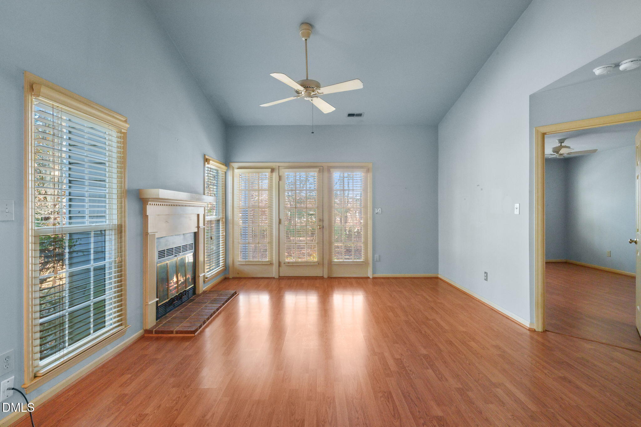 1212 Berley Court Raleigh, NC 27609 - Photo 10 of 38 a view of an empty room with a window and wooden floor