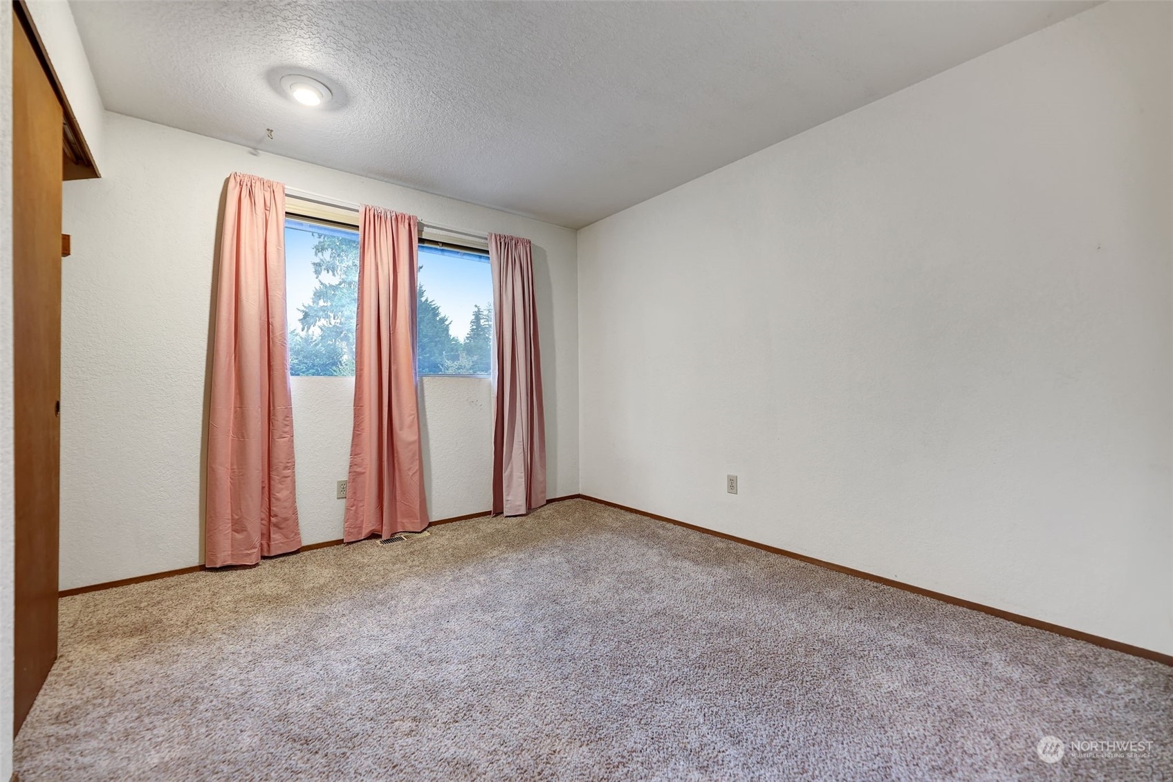 17206 30th Drive Southeast Bothell, WA 98012 - Photo 11 of 40 an empty room with windows