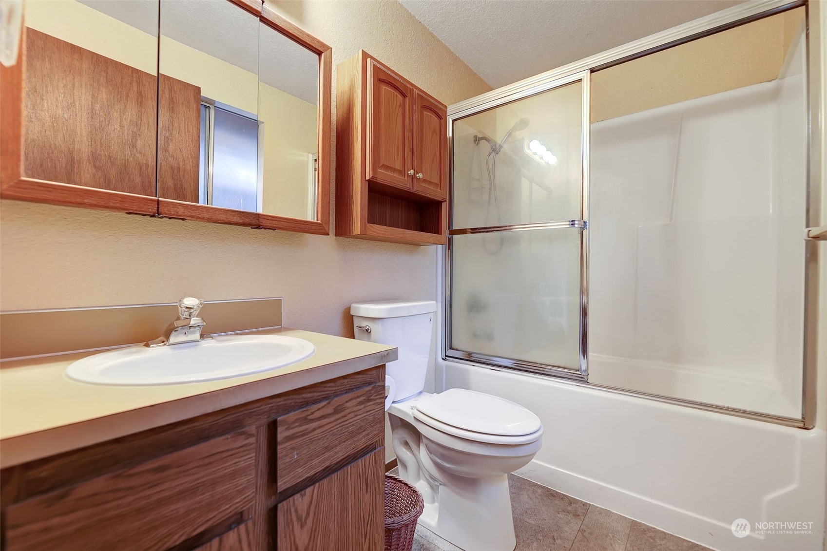 17206 30th Drive Southeast Bothell, WA 98012 - Photo 16 of 40 a bathroom with a sink a toilet and shower