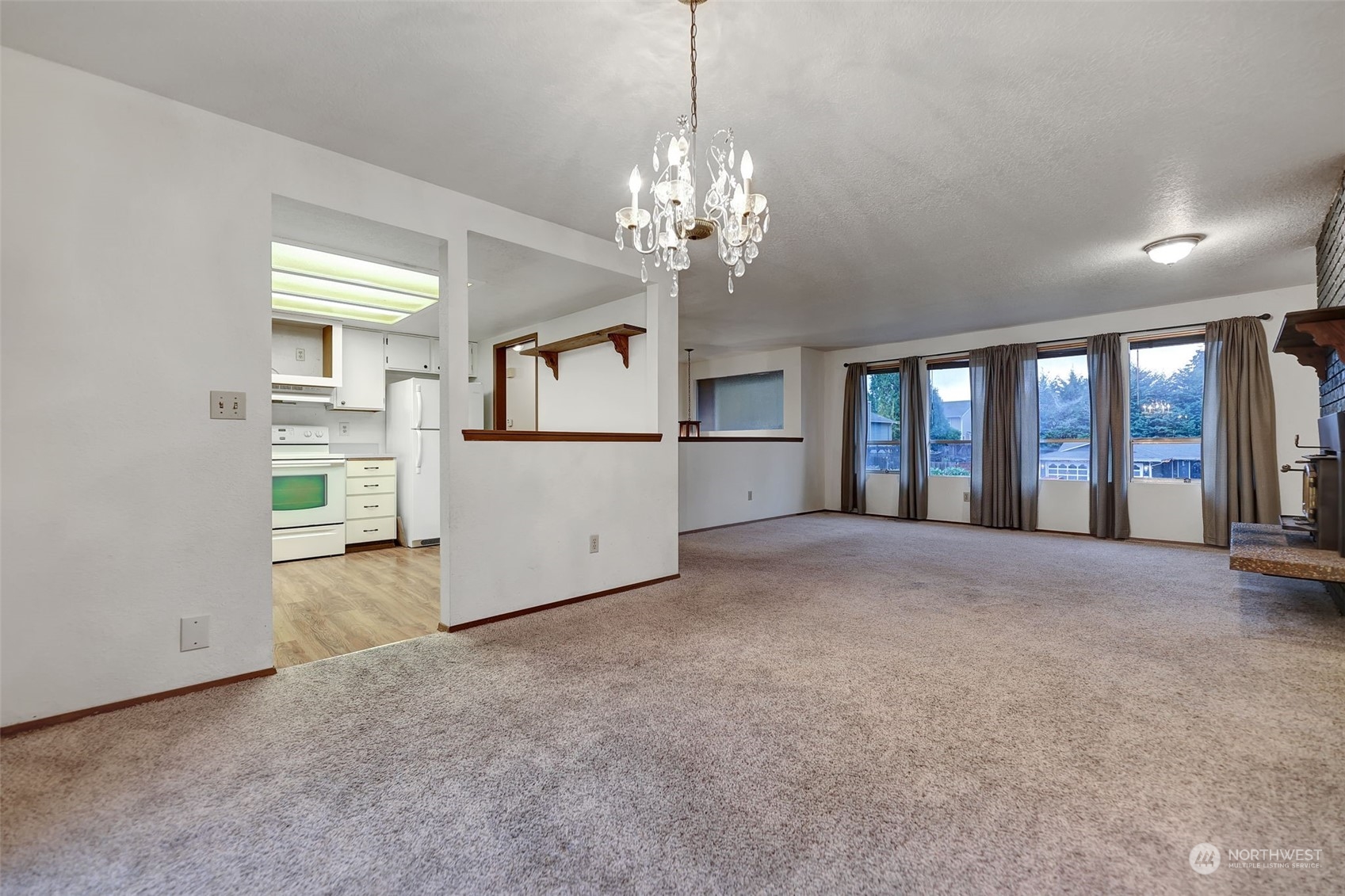 17206 30th Drive Southeast Bothell, WA 98012 - Photo 5 of 40 a view of empty room with windows and ceiling fan