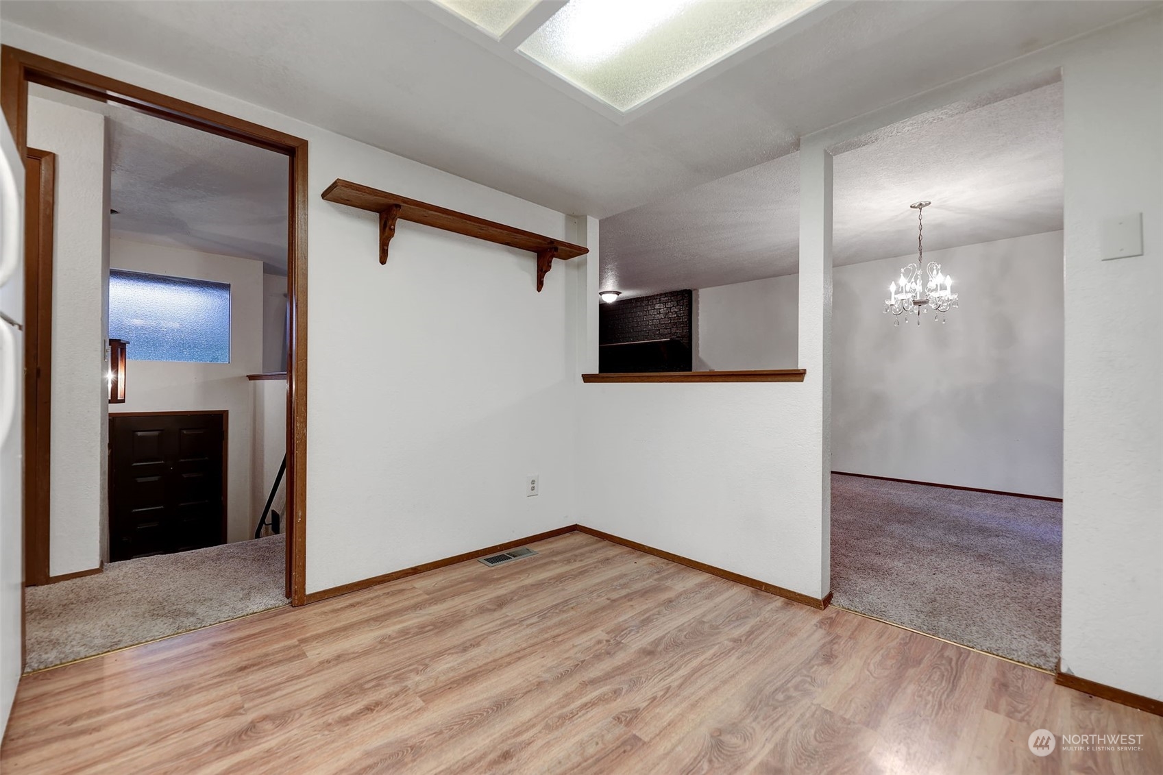 17206 30th Drive Southeast Bothell, WA 98012 - Photo 8 of 40 an empty room with wooden floor