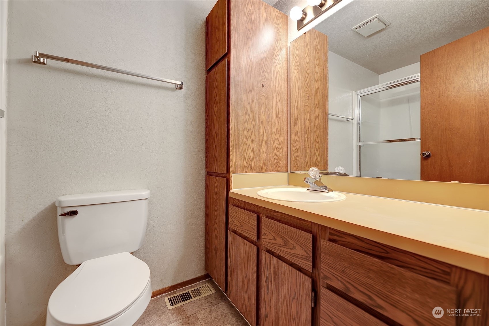 17206 30th Drive Southeast Bothell, WA 98012 - Photo 10 of 40 a bathroom with a granite countertop sink toilet and shower