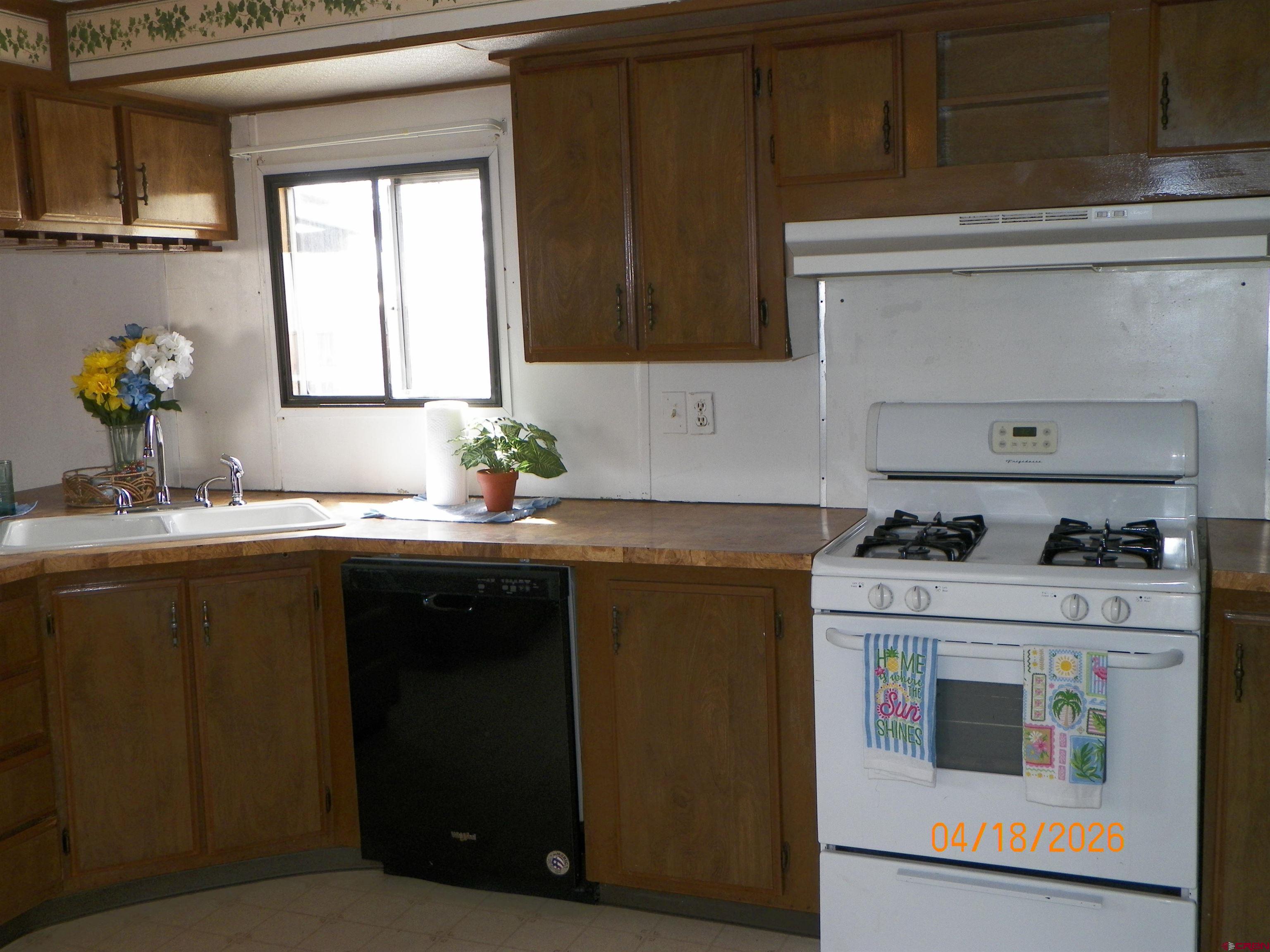 240 Southwest 13th Circle Cedaredge, CO 81413 - Photo 14 of 30 a kitchen with a stove and a sink