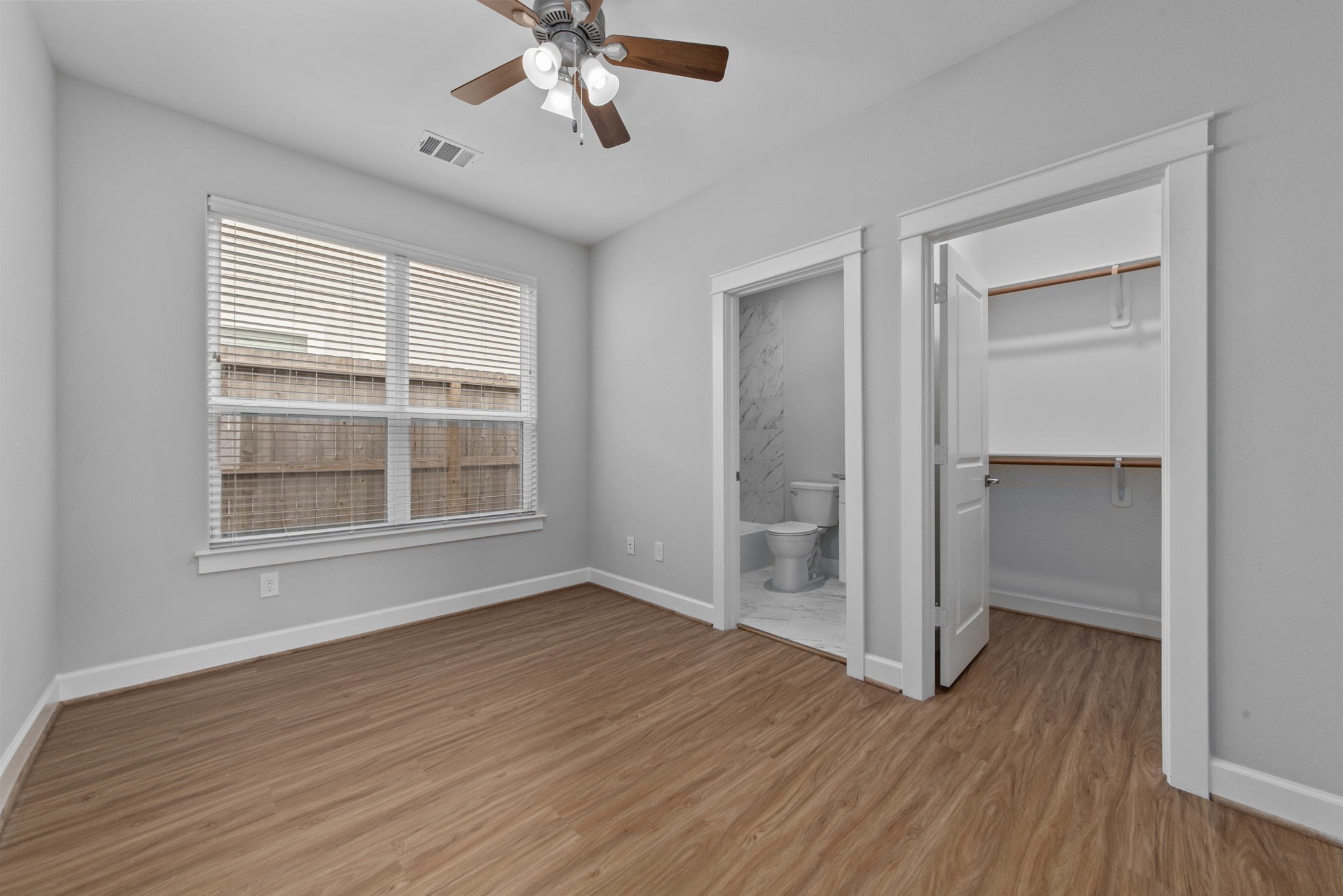 623 Link Road Houston, TX 77009 - Photo 18 of 25 a view of an empty room with wooden floor and a window