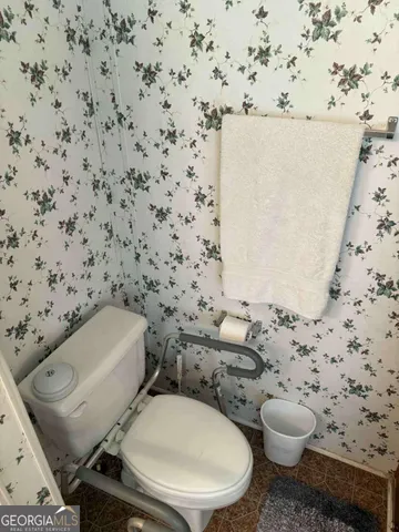 a bathroom with a toilet and a sink