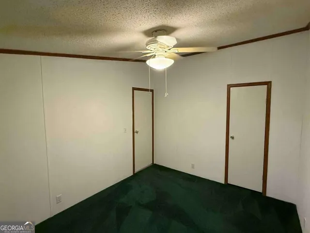a view of a chandelier fan and closet in a room